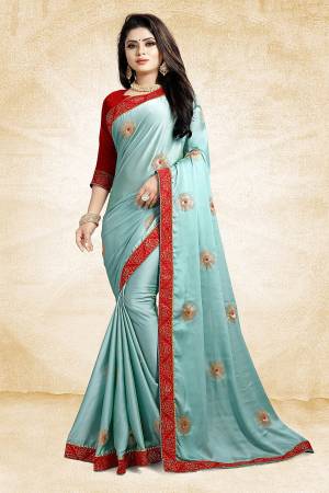 Celebrate This Festive Season With Beauty And Comfort Wearing This Designer Saree In Sky Blue Color Paired With Contrasting Red Colored Blouse. This Saree Is Fabricated On Satin Georgette Paired With Art Silk Fabricated Blouse. It Is Beautified With Embroidered Butti All Over.