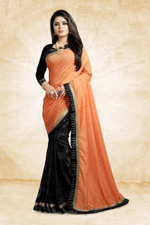 Here Is A Beautiful Designer Saree For The Next Party You Attend. Grab This Designer Saree In Orange And Black Color Paired With Black Colored Blouse, This Saree Is Fabricated On Linen And Fancy Fabric Paired With Art Silk Fabricated Blouse. It Has Pretty Fancy Work And Frill Lace Border. 