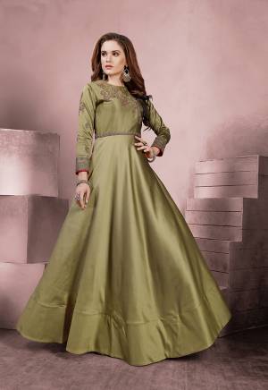 New Shade Is Here To Add Into Your Wardrobe With This Designer Readymade Gown In Light Olive Green Color Fabricated On Tafeta Art Silk. Its Rich Fabric And Color Will Earn You Lots Of Compliments From Onlookers. Buy Now.