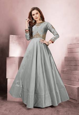 Flaunt Your Rich And Elegant Taste Wearing This Designer Readymade Silk Based Gown In Grey Color. This Gown Is Fabricated On Tafeta Silk Beautified With Embroidery. Buy This Designer Piece Now.