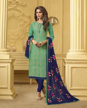 Add This Pretty Dress Material To Your Wardrobe In Sea Green Colored Top Paired With Contrasting Navy Blue Colored Bottom And Dupatta. Its Top Is Fabricated On Jacquard Silk Paired With Cotton Bottom And Chiffon Fabricated Dupatta. Get This Stitched As Per Your Desired Fit And Comfort.