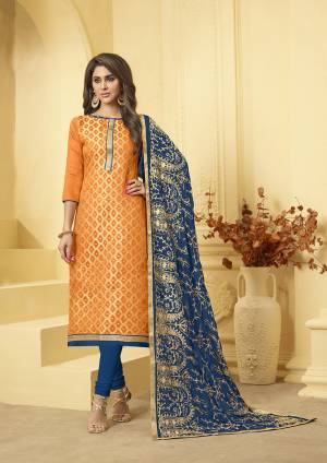 Add This Pretty Dress Material To Your Wardrobe In Orange Colored Top Paired With Contrasting Navy Blue Colored Bottom And Dupatta. Its Top Is Fabricated On Jacquard Silk Paired With Cotton Bottom And Chiffon Fabricated Dupatta. Get This Stitched As Per Your Desired Fit And Comfort.