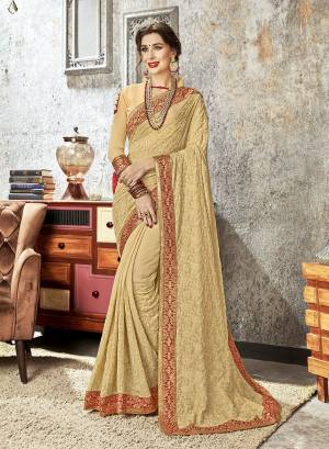 Simple And Elegant Looking Heavy Designer Saree Is Here In Beige Color Paired With Beige Colored Blouse, This Saree Is Fabricated On Chiffon Paired With Art Silk Fabricated Blouse. It Is Beautified with Tone To Tone Embroidery And Lace Border. 