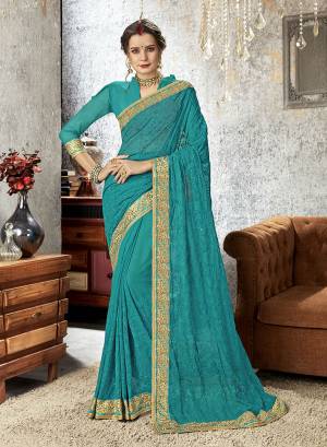 Add This Beautiful Designer Saree To Your Wardrobe In Blue Color Paired With Blue Colored Blouse. This Heavy Tone To Tone Embroidered Saree Is Chiffon Based Paired With Art Silk Fabricated Blouse. Buy This Designer Piece Now.