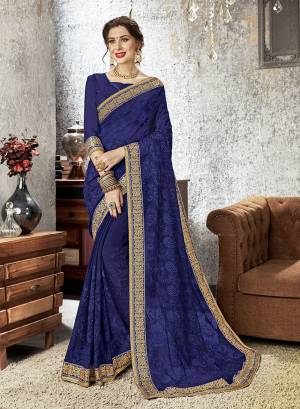 Shine Bright Wearing This Heavy Designer Saree In Royal Blue Color Paired With Royal Blue Colored Blouse. This eavy Embroidered Saree Is Chiffon Paired With Art Silk Fabricated Bloue. Buy Now.