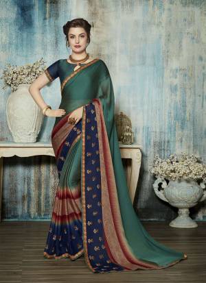 Here Is A Very Pretty Light Weight Designer Saree In Teal Green And Navy Blue Color Paired With Teal Green And Navy Blue Colored Blouse. This Saree Is Georgette Based Paired With Art Silk Fabricated Blouse. Buy Now.
