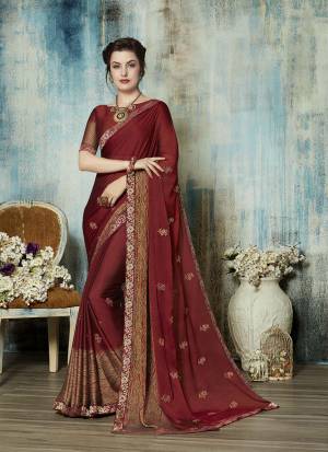 For A Royal Look, Grab This Designer Saree In Maroon Color Paired With Maroon Colored Blouse. This Saree Is Fabricated On Georgette Paired With Art Silk Fabricated. With Beauty This Saree Also Ensures Superb Comfort All Day Long. 