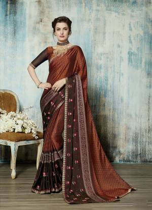 Add This Beautiful Designer Saree To Your Wardrobe In Rust And Brown Color Paired With Rust And Brown Colored Blouse. This Saree Is Georgette Based Paired With Art Silk Fabricated Blouse. Buy This Saree Now.