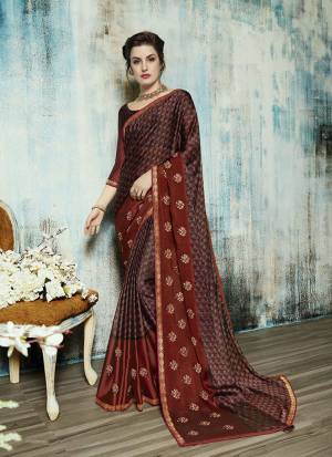 For A Royal Look, Grab This Designer Saree In Maroon And Brown Color Paired With Maroon And Brown Colored Blouse. This Saree Is Fabricated On Georgette Paired With Art Silk Fabricated. With Beauty This Saree Also Ensures Superb Comfort All Day Long. 