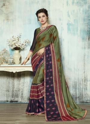 Celebrate This Festive Seaosn Wearing This Designer Saree In Olive Green And Navy Blue Color. This Saree Is Georgette Based Paired With Art Silk Fabricated Blouse. Its Fabric IS Soft Towards Skin And Ensures Superb Comfort All Day Long. 
