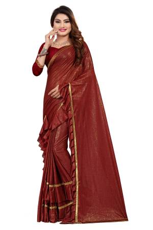Get Ready For The Upcoming Party At Your place With This Designer Saree In Maroon Color Paired With Maroon Colored Blouse. This Saree Is Fabricated On Lycra Paired With Art Silk Fabricated Blouse. It Has Pretty Two Layer Frill With Lace Border. Buy This Designer Piece Now. 