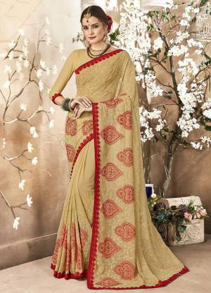Simple And Elegant Looking Designer Saree Is Here In Beige Color Paired With Beige Colored Blouse. This Saree Is Georgette Based Paired With Art Silk Fabricated Blouse. It Is Beautified With Tone To Tone And Red Colored Resham Embroidery With Stone Work. 