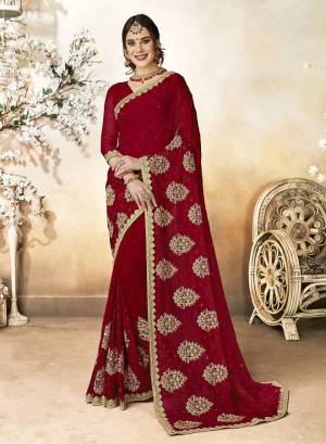Add This Beautiful designer Saree To Your Wardrobe In Maroon Color. This Saree Is Fabricated On Georgette Paired With Art Silk Fabricated Blouse. It Is Beautified With Subtle Tone To Tone Embroidery And Stone Work. 