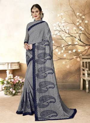 Flaunt Your Rich And Elegant Taste Wearing This Designer Saree In Grey Color Paired With Grey Colored Blouse. This Saree Is Fabricated On Georgette Paired With Art Silk Fabricated Blouse. It Is Beautified With Subtle Resham Embroidery Giving It A Rich And Elegant Look. Buy Now.