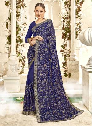 Shine Bright Wearing This Heavy Designer Saree In Royal Blue Color Paired With Royal Blue Colored Blouse. This Saree And Blouse are Georgette Based Beautified With Attractive Heavy Embroidery And Stone Work. 