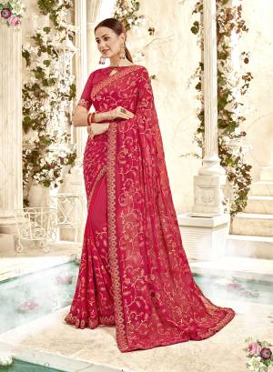 Adorn The Pretty Angelic Look In This Heavy Designer Dark Pink Colored Saree Paired With Dark Pink Colored Blouse. This Saree And Blouse are Georgette Based Beautified With Heavy Embroidery. 