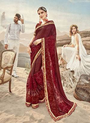 Get Ready For The Upcoming Wedding Season with This Designer Saree In Maroon Color Paired With Maroon Colored Blouse. This Saree Is Fabricated On Lycra And Net paired With Art Silk Fabricated Blouse. It Has Pretty Tone To Tone Embroidery Giving It A Heavy Subtle Look. 
