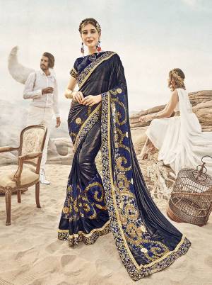Enhance Your Personality Wearing This Designer Saree In Navy Blue Color Paired With Navy Blue Colored Blouse. This Saree Is Fabricated On Lycra and Net Paired With Art Silk Fabricated Blouse. Buy This Designer Piece Now.