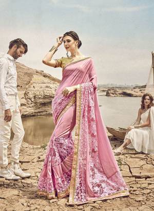 Look Pretty In This Designer Pink Colored Saree Paired With Golden Colored Blouse. This Saree Is Fabricated On Lycra And Net Paired With Art Silk Fabricated Blouse. It Has Pretty Tone To Tone Embroidery Which Earn You Lots of Compliments From Onlookers. 