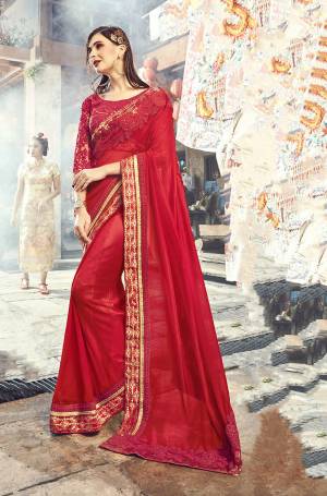 Catch All The Limelight Wearing This Designer Saree In Red Color Paired With Red Colored Blouse. This Heavy Embroidered Saree Is Georgette Based paired With Art Silk And Net Fabricated Blouse.