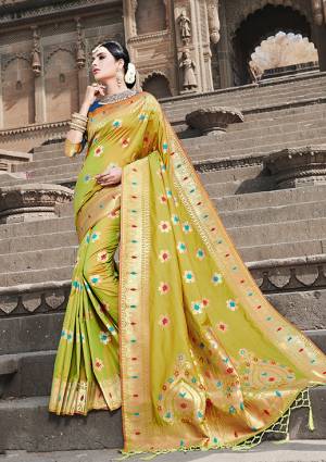 Look Pretty In This Designer Silk Based Saree Beautified With Weave All Over. Its Rich Banarasi Art Silk Fabric And Unique Weave Pattern Will Earn You Lots Of Compliments From Onlooker