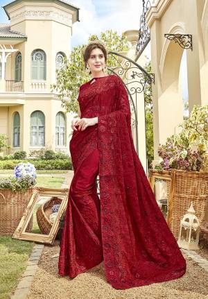 Grab This Very Pretty Designer Saree In Red Color Paired With Red Colored Blouse. This Heavy Embroidered Saree IS Fabricated On Chiffon Paired With Art Silk Fabricated Blouse. It Is Beautified With Rich And Subtle Tone To Tone Embroidery With Stone Work. Buy Now.