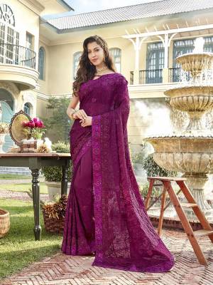 You Will Definitely Earn Lots Of Compliments In This Rich Looking Heavy Designer Saree In Purple Color Paired With Purple Colored Blouse. This Saree Is Chiffon Based Paired With Art Silk Fabricated Blouse. It Has Very Pretty Tone To Tone Embroidery All Over. 