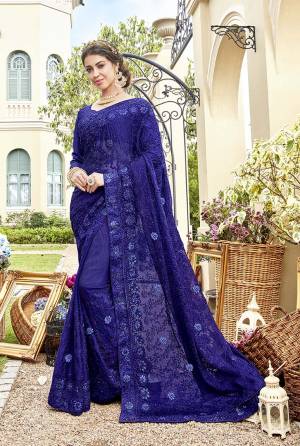 Grab This Very Pretty Designer Saree In Royal Blue Color Paired With Royal Blue Colored Blouse. This Heavy Embroidered Saree IS Fabricated On Chiffon Paired With Art Silk Fabricated Blouse. It Is Beautified With Rich And Subtle Tone To Tone Embroidery With Stone Work. Buy Now.