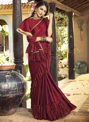 Catch All The Limelight At The Next Party You Attend With This Designer Saree In Maroon Color Paired With Maroon Colored Blouse. This Saree Is Lycra Based Paired Art Silk Fabricated Blouse. It Has Very Beautiful And Trending Frill Border Pattern. Buy This Designer Saree Now.