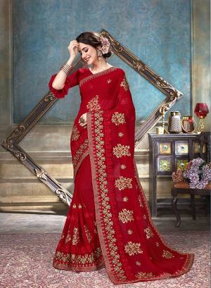 A Must Have Shade In Every Womens Wardrobe Is Here With This Designer Saree In Red Color Paired With Red Colored Blouse. This Saree And Blouse Are Fabricated On Georgette Beautified With Jari And Thread Embroidery With Stone Work. 