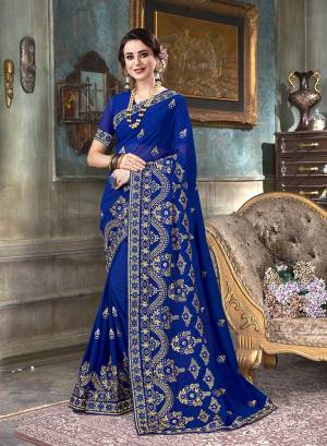 Shine Bright In This Beautiful Designer Saree In Royal Blue Color Paired With Royal Blue Colored Blouse. This Saree And Blouse Are Georgette Based Beautified With Jari And Thread Embroidery With Stone Work.