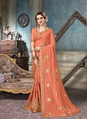 For A Royal Look, Grab This Designer Saree In Dark Peach Color Paired With Dark Peach Colored Blouse. This Saree And Blouse Are Georgette Based Beautified With Heavy And Attractive Embroidery All Over. 