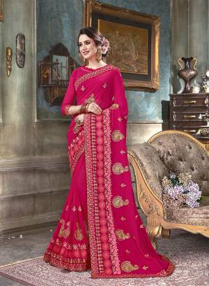 Here Is A Very Pretty Designer Saree In Dark Pink Color Paired With Dark Pink Colored Blouse. This Saree And Blouse Are Georgette Based Beautified With Heavy Jari And Thread Work. 