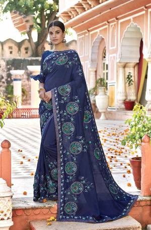 Enhance Your Personality Wearing This Designer Saree In Blue Color Paired With Blue Colored Blouse. This Saree And Blouse Are Silk Based Which Gives A Rich Look To Your Personality. 