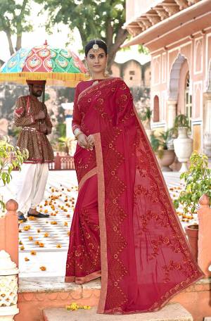 Adorn The Pretty Angelic Look In This Designer Red Colored Saree Paired With Red Colored Blouse. This Pretty Embroidered Saree In Georgette Based Paired With Art Silk Fabricated Blouse. 