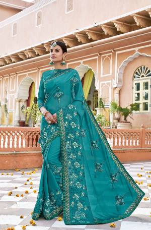This Festive Season Be The Most Stunning Amongst All Wearing This Designer Saree In Turquoise Blue Color. This Saree Is Fabricated On Georgette Paired With Art Silk Fabricated Blouse. 