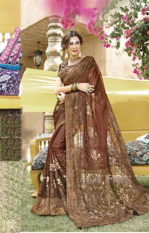 Enhance Your Personality In This Designer Rich Looking Saree In Brown Color Paired With Brown Colored Blouse, This Saree Is Fabricated On Georgette Paired With Art Silk Fabricated Blouse. 