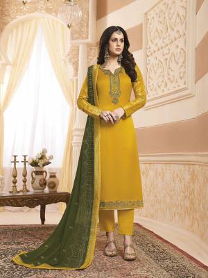 Celebrate This Festive Season Wearing This Designer Straight Suit In Yellow Colored Top And Bottom Paired With Contrasting Dark Olive Green Colored Dupatta. Its Pretty Embroidered Top Is Satin Georgette Based Paired With Santoon Bottom And Georgette Fabricated Dupatta. 