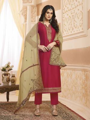 Shine Bright Wearing This Designer Straight Suit In Dark Pink Color Paired With Beige Colored Dupatta. Its Top IS Satin Georgette Based Paired With Santoon Bottom And Georgette Fabricated Dupatta. Buy Now.