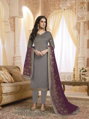 Flaunt Your Rich And Elegant Taste Wearing This Designer Embroidered Straight Suit In Grey Color Paired With Contrasting Purple Colored Dupatta. Its Top Is Fabricated On Satin Georgette Paired With Santoon Bottom And Georgette Fabricated Dupatta. 
