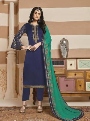 Enhance Your Personality In This Designer Straight Suit In Navy Blue Color Paired with Contrasting Sea Green Colored Dupatta. Its Top Is Fabricated On Satin Georgette Paired With Santoon Bottom And Georgette Fabricated Dupatta. 