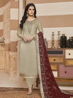 Simple and Elegant Looking Designer Straight Suit Is Here In Rich Cream Color Paired With Maroon Colored Dupatta., Its Top Is Fabricated On Satin Georgette Paired With Santoon Bottom And Georgette Fabricated Dupatta. 
