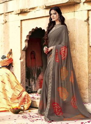 Flaunt Your Rich And Elegant Taste Wearing This Pretty Saree In Grey Color Paired With Grey Colored Blouse. This Saree Is Fabricated On Georgette Paired With Art Silk Fabricated Blouse.  It Is Light In Weight And Easy To Carry All Day Long. 