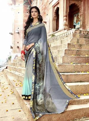 Flaunt Your Rich And Elegant Taste Wearing This Pretty Saree In Grey Color Paired With Grey Colored Blouse. This Saree Is Fabricated On Georgette Paired With Art Silk Fabricated Blouse.  It Is Light In Weight And Easy To Carry All Day Long. 