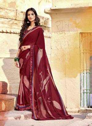 Celebrate This Festive Season With Beauty And Comfort Wearing This Saree In Maroon Color Paired With Maroon Colored Blouse. This Saree Is Georgette Based Paired With Art Silk Fabricated Blouse. 