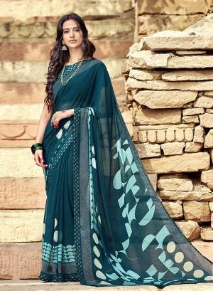 Grab This Designer Simple And Elegant Looking Saree In Teal Blue Color Paired With Teal Blue Colored Blouse. This Saree Is Fabricated On Georgette Paired With Art Silk Fabricated Blouse. 