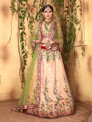 This Festive Season, Look The Most Unique And Prettiest Of All Wearing This Designer Lehenga Choli Fabricated On Jari Satin Beautified With Attractive Digital Prints Paired With Net Fabricated Dupatta Beautified With Stone Work. 
