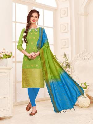 If Those Readymade suit Does Not Lend You The Desired Comfort Than Grab This Dress Material In Green Colored Top Paired With Blue Colored Bottom And Green & Blue Colored Shaded Dupatta. Its Top And Dupatta Are Banarasi Jacquard Silk Based Paired With Cotton Fabricated Bottom. 