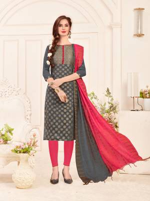 Rich And Elegant Looking Designer Straight Suit Is Here In Dark Grey Colored Top Paired With Dark Pink Colored Bottom And Dark Pink And Grey Colored Dupatta. Its Top And Dupatta Are Fabricated On Banarasi Jacquard Silk Paired With Cotton Bottom. Buy This Dress Material Now.