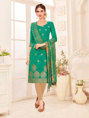 Celebrate This Festive Season With Beauty And Comfort Wearing This Straight Suit In Sea Green Colored Top Paired With Contrasting Beige Colored Bottom And Sea Green Colored Dupatta. Its Top And Dupatta Are Fabricated On Banarasi Jacquard Silk Paired With Cotton Bottom. Buy This Dress Material Now.